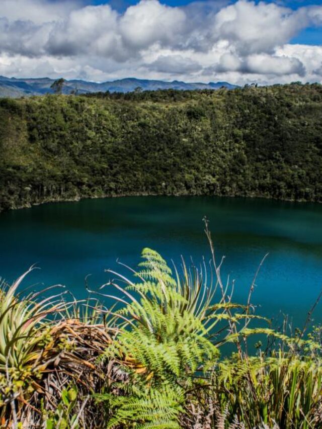 Landscape of the Laguna del Cacique Guatavita surrounded by greenery under the sunlight in Colombia